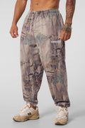 2063 Tree Camo Baggy Joggers — oversized, street-ready comfort with elastic cuffs, durable heavyweight terry, and a relaxed camo fit for everyday wear, in Beige.
