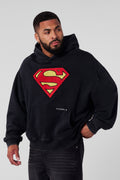 5079 - Superman Legacy Hoodies- Superman Legacy Hoodie in 460 GSM soft cotton with relaxed fit, featuring a chenille Superman logo patch on the chest and a clean acid-washed finish in Black Wash  