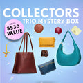 Promotional graphic for a 'Collectors Trio Mystery Box' featuring a collection of bags, wallets, and small goods. Set against a sparkly background with a pink badge indicating up to $530 value.