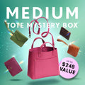 Promotional graphic for a 'Medium Tote Mystery Box' featuring a collection of totes, wallets, and small goods. Set against a sparkly background with a pink badge indicating up to $248 value.