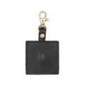 Pebbled--black | Square-shaped leather AirTag holder with snap closure and swivel lobster claw clasp