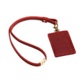 Phoenix | A leather lanyard attached to a matching card holder on a white background